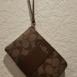 Women's  N.W.T.S. Brown  small  Carriage clutch with strap